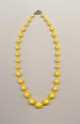 A graduated plastic imitation bead necklace for a child, early 1960's, length 16'' 40cm.